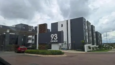 a building with a sign in front of it at Elegant & Timeless at 93 on new in Midrand