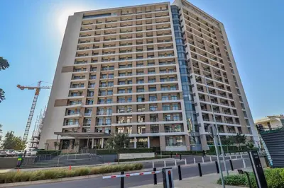 a large apartment building in front of a street at Menlyn Maine 1413 in Pretoria