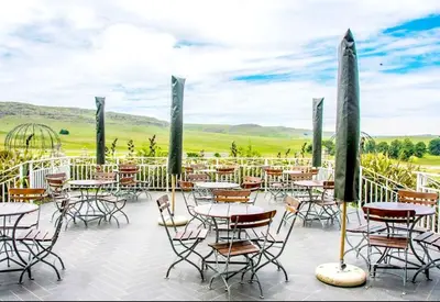 a patio at a restaurant with tables and chairs at Elegant 4 ppl Villa nested in a picturesque town