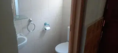 a bathroom with a toilet and a sink at Limelight in Polokwane