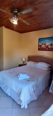 a bedroom with a white bed with a ceiling at 16 Besembos contractors accommodation in Witbank