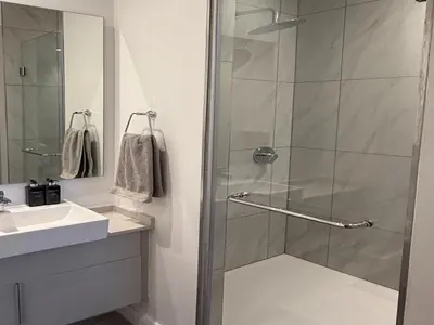 a bathroom with a shower and a sink at 136 Trilogy in Pretoria