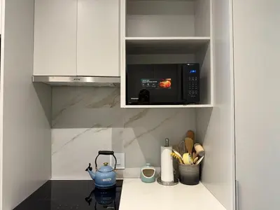 a kitchen with a counter top with a microwave at 136 Trilogy in Pretoria