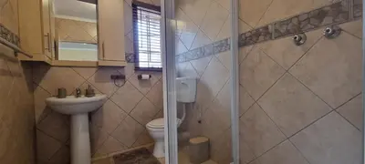 a bathroom with a toilet and a glass shower at Bet Baruch Accommodation 1 in Polokwane