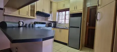 a kitchen with a black counter top in a room at Bet Baruch Accommodation 1 in Polokwane