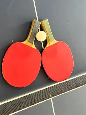 two red pairs of scissors hanging on a wall at 326onMackenzieSt in Pretoria