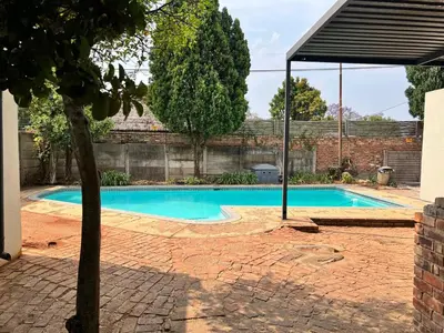 a swimming pool in the backyard of a house at 326onMackenzieSt in Pretoria