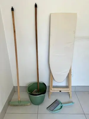a room with a broom and a bucket and a sink at 326onMackenzieSt in Pretoria