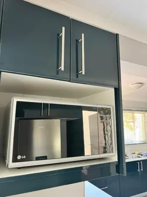 a microwave oven sitting on top of a kitchen counter at 326onMackenzieSt in Pretoria
