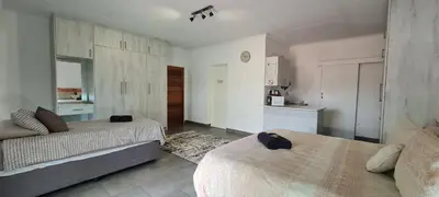 a small room with two beds and a kitchen at Tenuta Overnight Suite in Polokwane