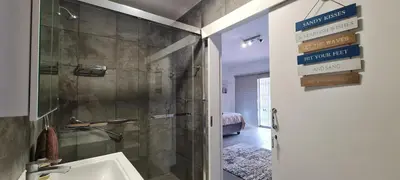 a bathroom with a shower and a sink at Tenuta Overnight Suite in Polokwane