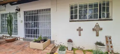 a church with a cross on the side of a building at Tenuta Overnight Suite in Polokwane