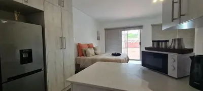 a kitchen with a room with a bed in it at Tenuta Overnight Suite in Polokwane