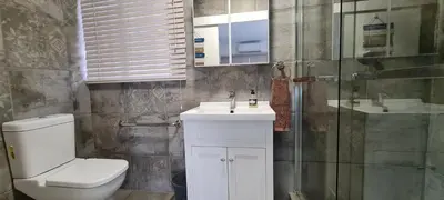 a bathroom with a toilet and a sink and a shower at Tenuta Overnight Suite in Polokwane