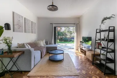 a living room with a couch and a table at Maroelana Home in Pretoria