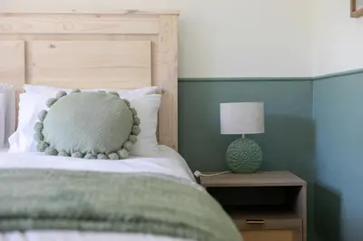 a bedroom with a bed with a pillow on it at Maroelana Home in Pretoria