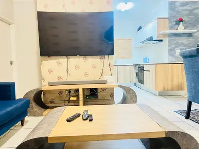 a living room with a tv and a coffee table at The Blyde Crystal Lagoon in Pretoria