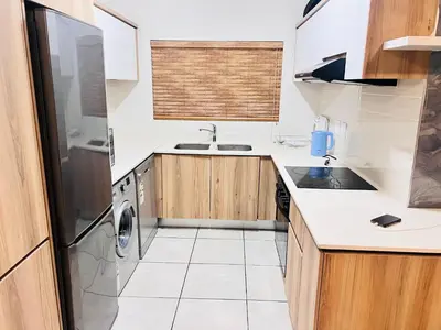 a kitchen with a sink and a dishwasher at The Blyde Crystal Lagoon in Pretoria