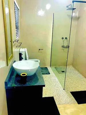 a bathroom with a bowl sink and a shower at Moonlight in Marloth Park