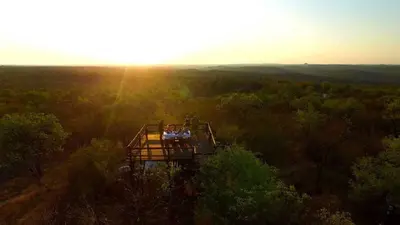 an overhead view of a tree house in the forest at Ezulwini Game Lodges in Balule Game Reserve