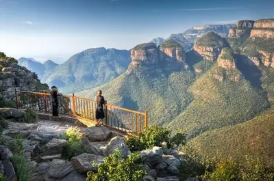 two people standing on a railing in the grand canyon at Morothong Guest Suites in Moremela