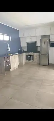 a large kitchen with stainless steel appliances at The Eyrie in Nelspruit