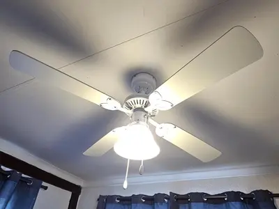 a ceiling fan with a light on a ceiling at Kruger Boutique Backpackers in Marloth Park