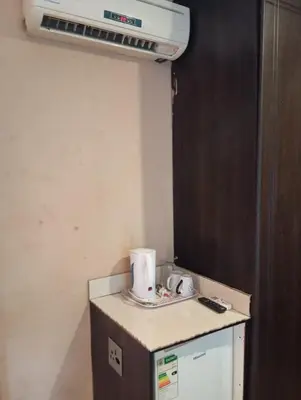a kitchen with a heater on top of a counter at Madiva Nelspruit Guest House in Nelspruit