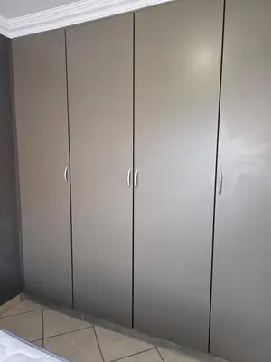 a closet with gray cabinets in a room at The Good Samaritan 2 in Witbank