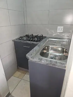 a kitchen with a sink and a stove at The Good Samaritan 2 in Witbank
