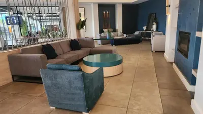 a living room with a couch and a table at White House At The Blyde Crystal Lagoon in Pretoria