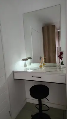 a white counter with a stool in front of a mirror at White House At The Blyde Crystal Lagoon in Pretoria