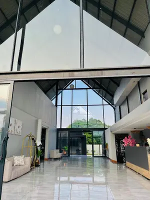 a large room with a large window and a lobby at The Legacy Hotel and Spa in Tzaneen
