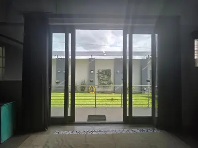 an open glass door with a view of a yard at 153 A Marshall in Polokwane