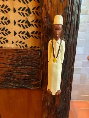 a figurine of a man in a hat on a wall at Reverie Safari Lodge, Marloth Park in Marloth Park