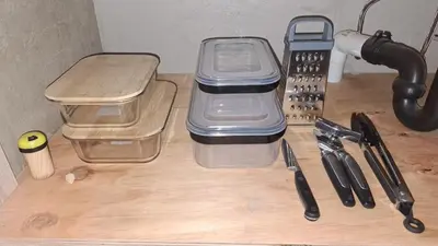 a table with two plastic containers on top of a desk at Roots of Grace in Polokwane