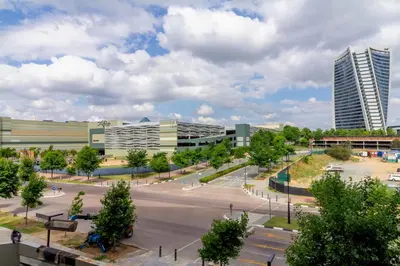 a view of a city with a parking lot at Ellipse Waterfall 4212 in Midrand