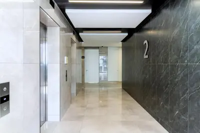 a hallway of an office building with a number on the wall at Ellipse Waterfall 4212 in Midrand