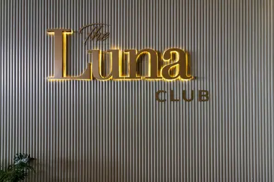 a sign for the tunga club on a wall at Ellipse Waterfall 4212 in Midrand