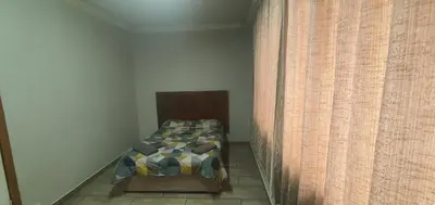 a bedroom with a bed and a wall at 329 on 30th Avenue Villieria Drian in Pretoria