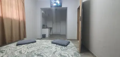 a bedroom with a bed with two pillows on it at 329 on 30th Avenue Villieria Justin in Pretoria