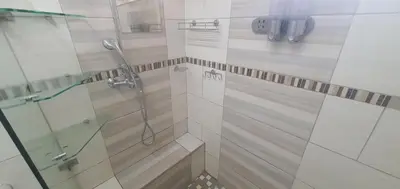 a bathroom with a shower with a glass door at 329 on 30th Avenue Villieria Justin in Pretoria