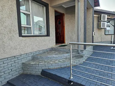 a house with a set of stairs in front of a door at The M GuestHouse in Kempton Park