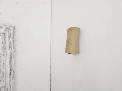 a door knob on a white door with a drawing at The M GuestHouse in Kempton Park