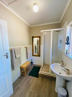 a bathroom with a shower and a sink at Springbok 47 in Polokwane
