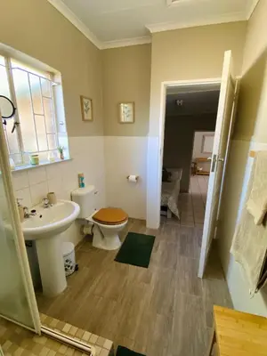 a bathroom with a toilet and a sink at Springbok 47 in Polokwane