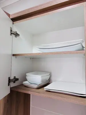a shelf with plates and bowls on it in a kitchen at The Blyde Riverwalk Estate - Luxury Escape in Pretoria