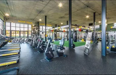 a gym with rows of treadmills and machines at The Blyde Riverwalk Estate - Luxury Escape in Pretoria