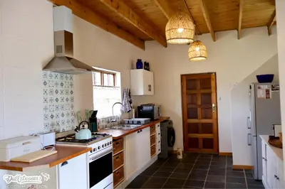 a kitchen with a sink and a stove top oven at Amber & Birch in Dullstroom