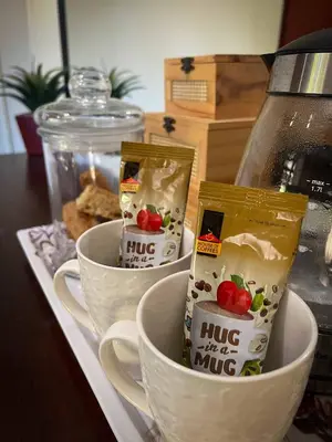 two cups of coffee sitting on a counter top at Wit Hangmat Bush Retreat in Sybrandskraal
